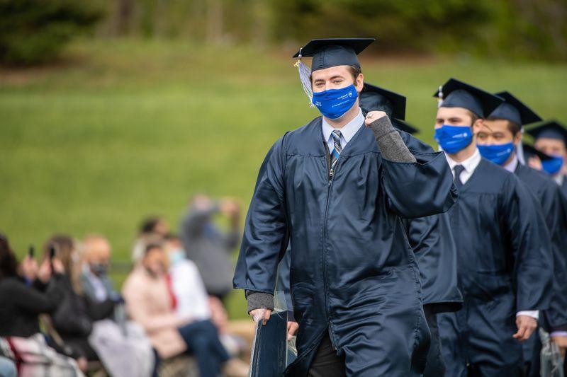 Penn State Behrend graduates celebrate as they leave the stadium at the conclusion of an outdoor ceremony on 5月8日.