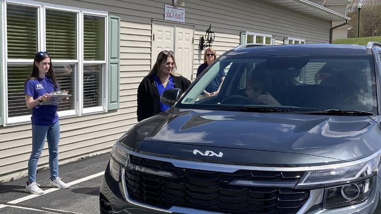 Penn State DuBois OTA students Emily Busija, center, and Maddie Barsh, right, work through a CarFit session as Amy Fatula, assistant teaching professor, watches on at the health and wellness fair at Christ the King Manor on April 25.